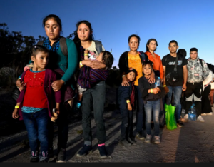 Photo of a group of people who appear to be new immigrants or asylum seekers