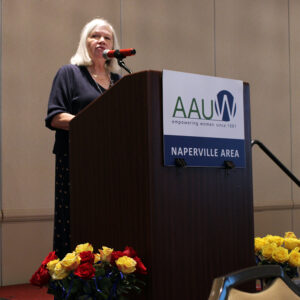 Lee Eastman speaking at podium during AAUW Naperville Area Awards Brunch